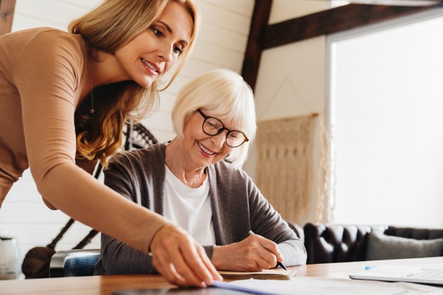 Daughter Helping Mother with Estate Planning