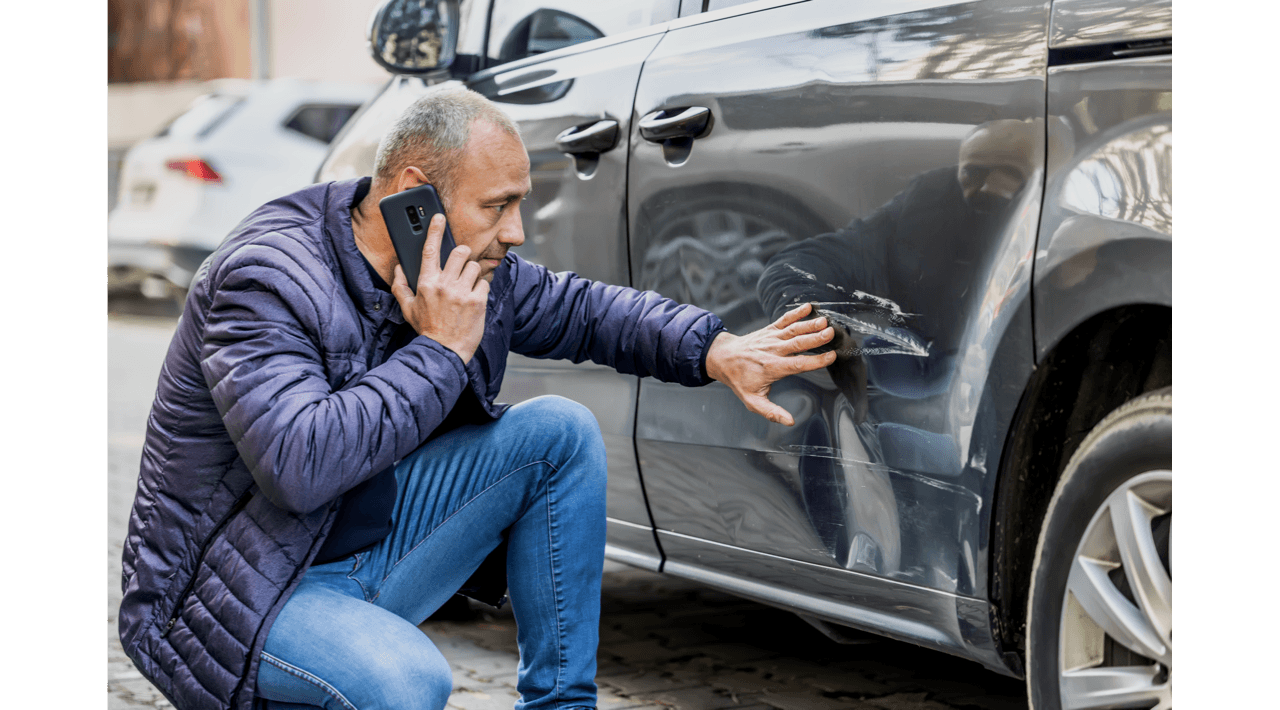 Man Checking Damage to His Vehicle