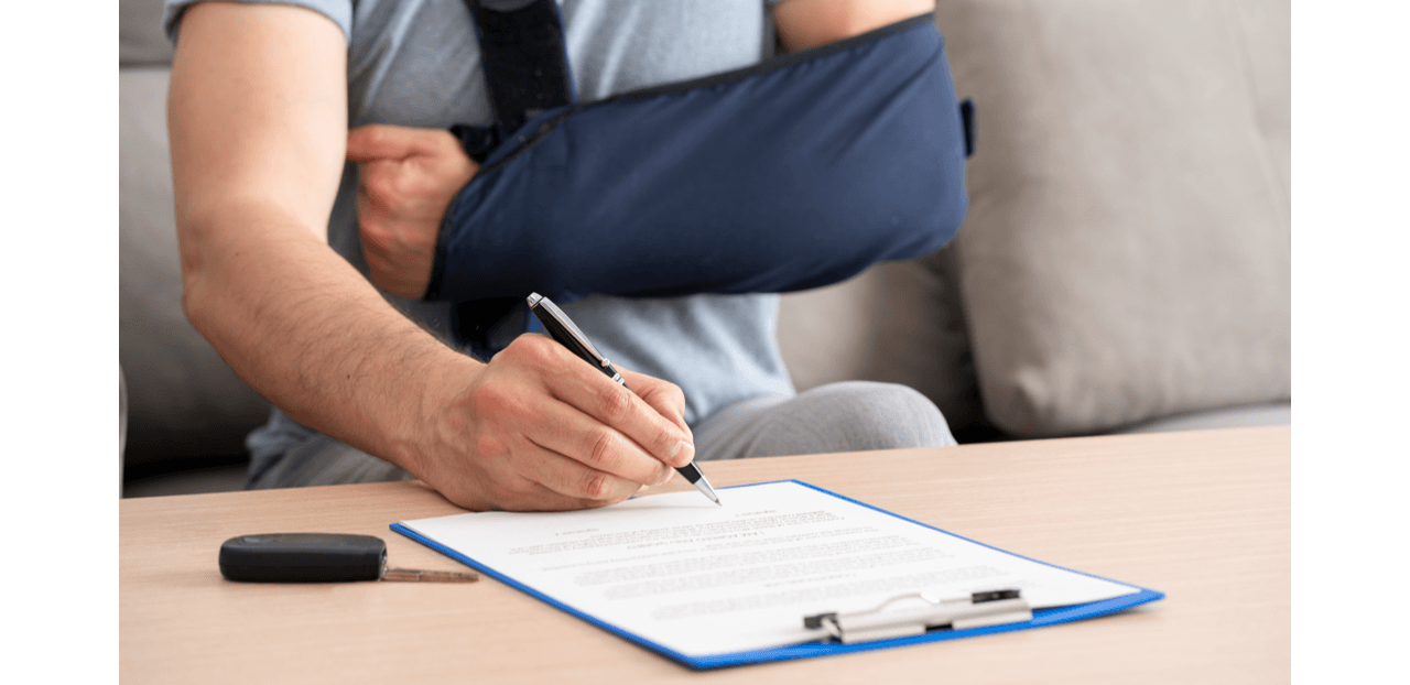Man with Arm Injury Signing a Document Man with Arm Injury Signing a Document