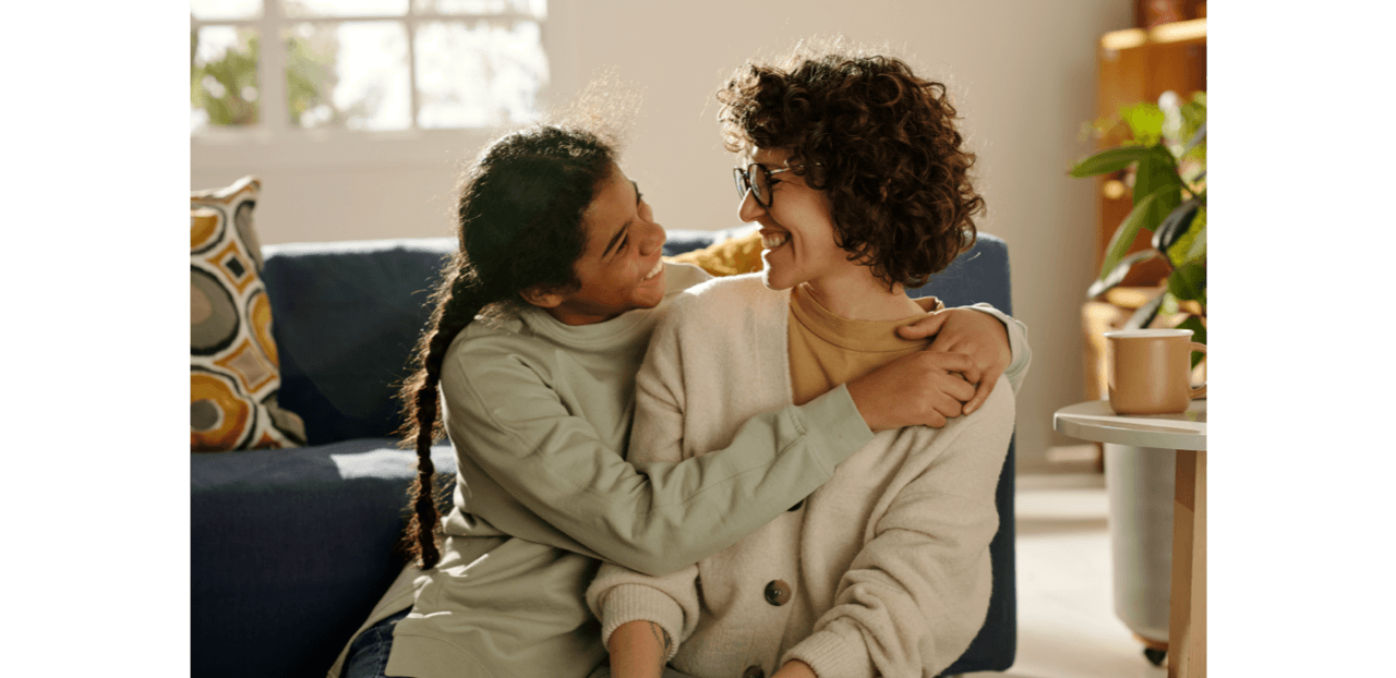 Mother and Daughter Smiling at Each Other Mother and Daughter Smiling at Each Other