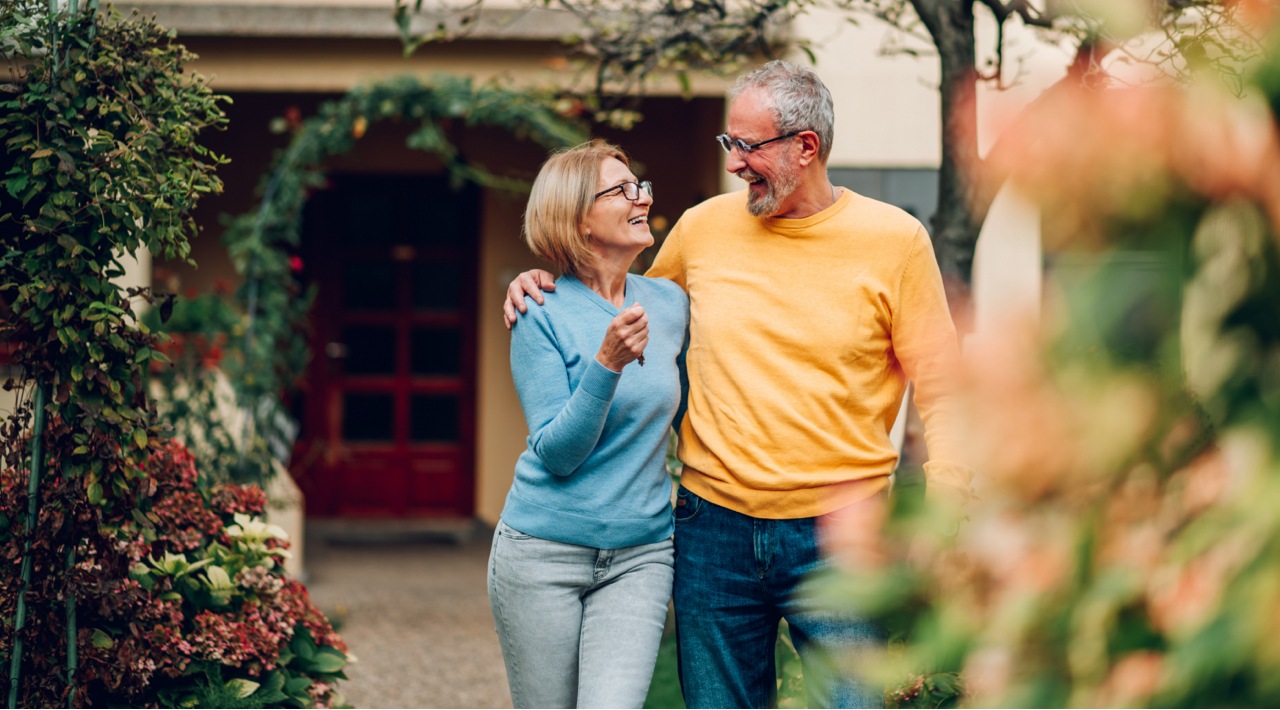 Couple Smiling Walking Through a Garden