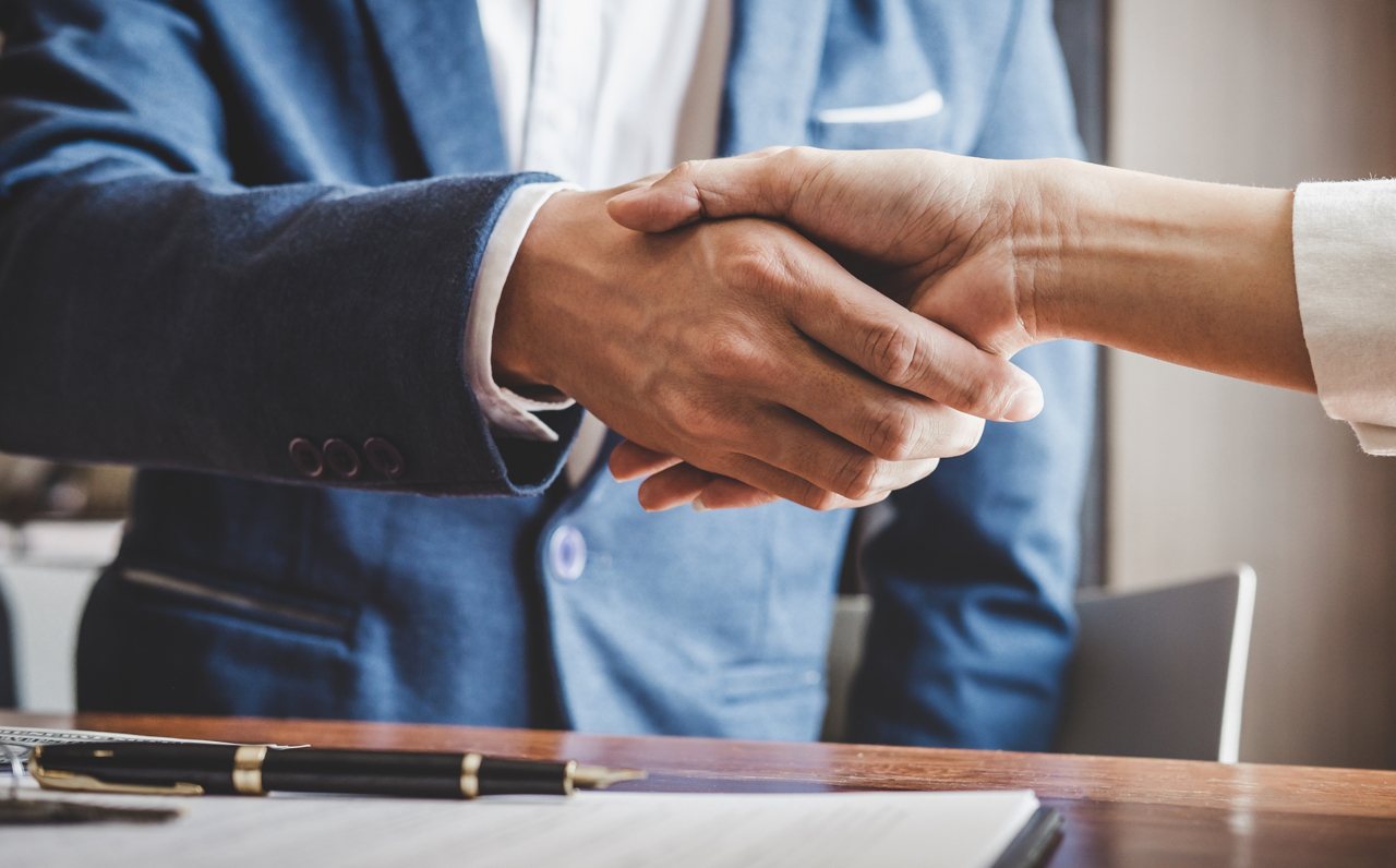 Lawyer Shaking Hand With Commercial Real Estate Agent